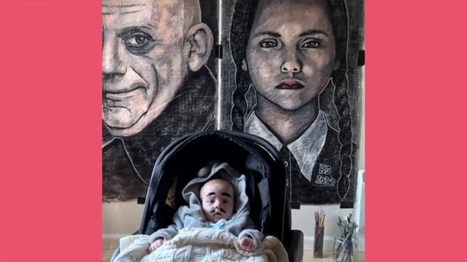 VIDEO: Baby poses in front of 'Addams Family' art exhibit