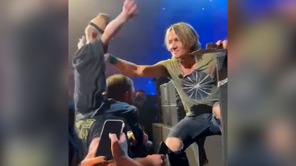 VIDEO: Keith Urban brings super fan onstage after noticing his sign 