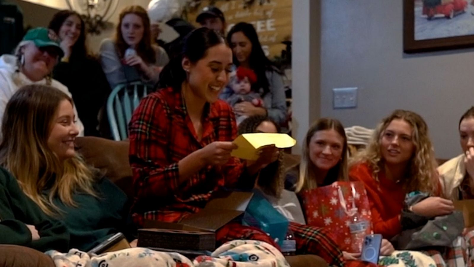 VIDEO: College athlete surprised with full scholarship in gift exchange