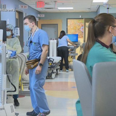 VIDEO: Hospitals strained by ‘tripledemic’ virus spike