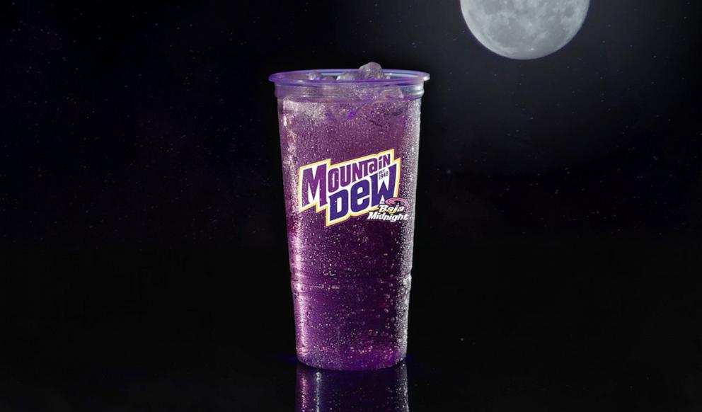 PHOTO: A new passionfruit flavored Mountain Dew Baja Midnight at Taco Bell.