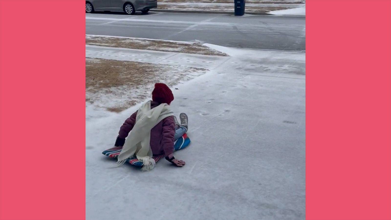 VIDEO: Young girls turn icy driveway into fun sledding runway