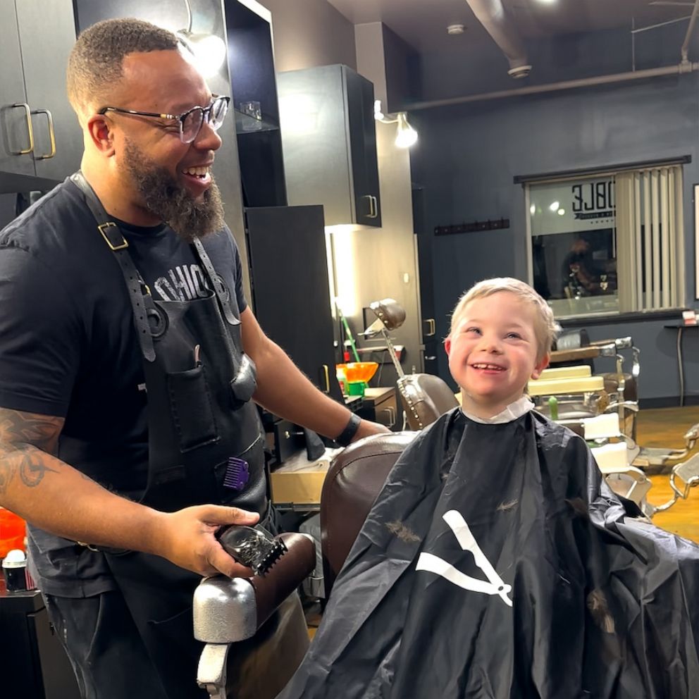 Barbershops put books in hands of kids getting haircuts