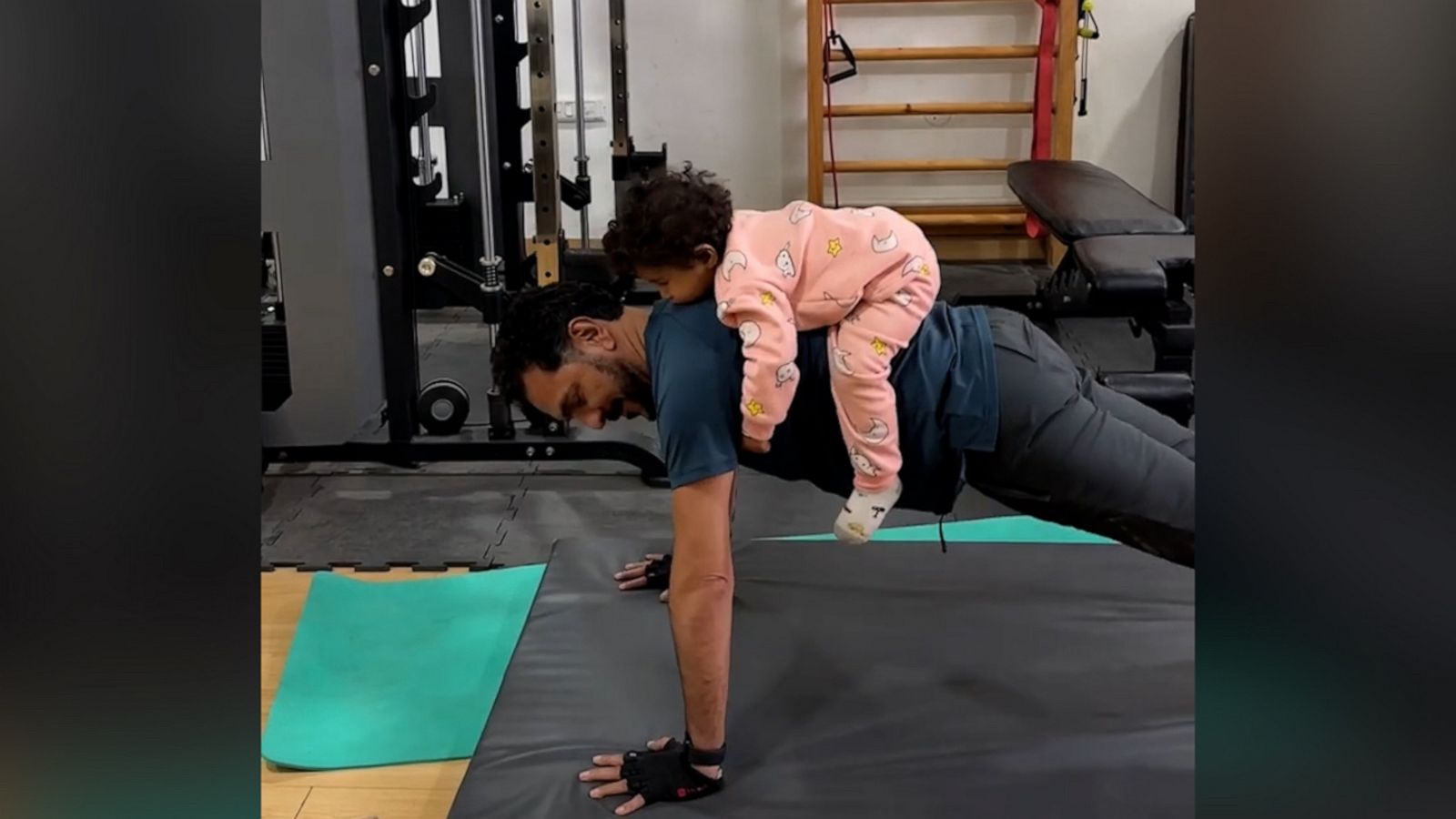 VIDEO: Watch this grandfather do pushups with granddaughter on his back