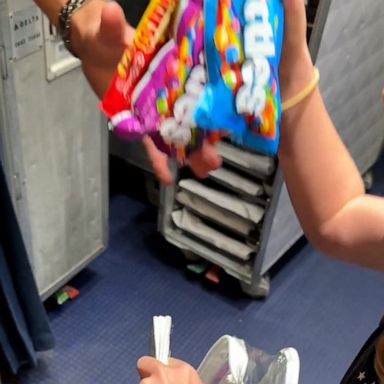 VIDEO: Little girl makes flight attendants' day by bringing them treats 