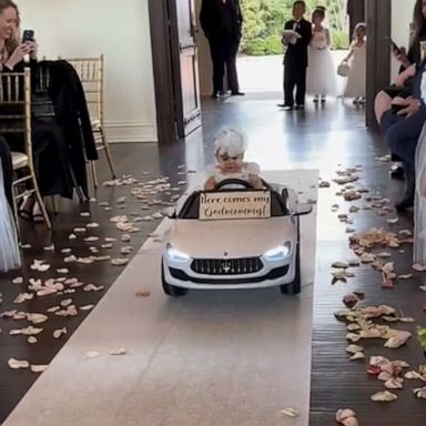 VIDEO: Flower girl has epic entrance for godmother's wedding ceremony