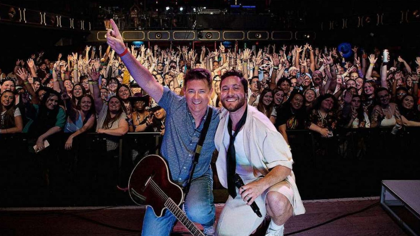 PHOTO: Musicians JORDY and John Hampson pose on stage after performing of "Story of a Boy."