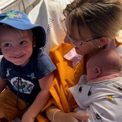 Excited toddler visits mom and new baby brother in the hospital