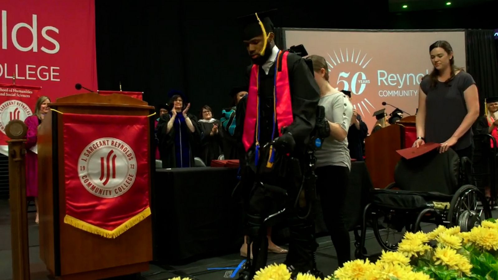 VIDEO: Watch moving moment paralyzed shooting victim walks across stage to receive diploma