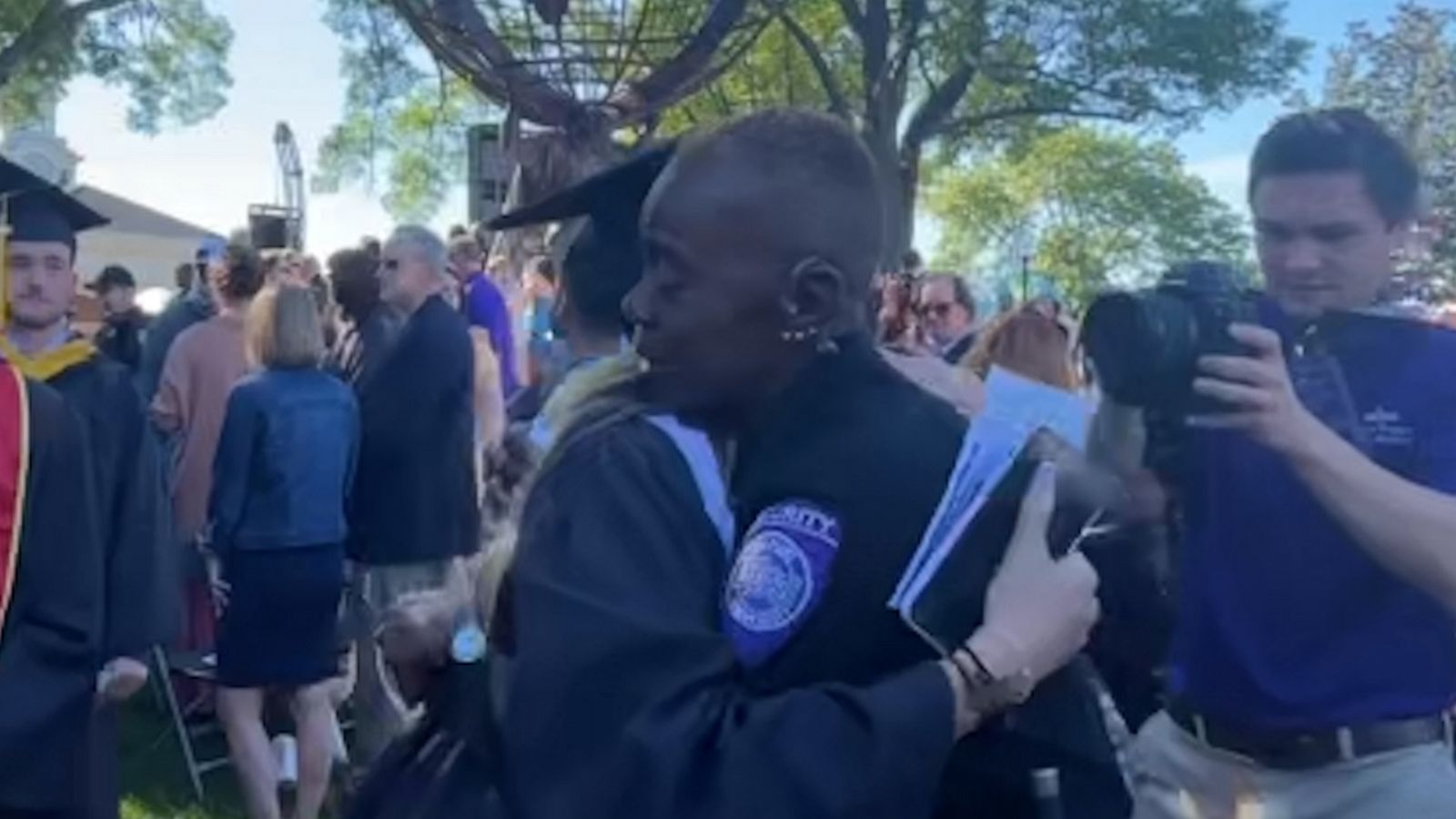 VIDEO: College graduates share emotional goodbyes with beloved university security officer