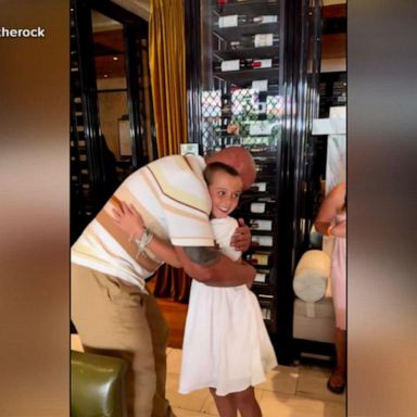 VIDEO: The Rock poses as waiter to surprise fan with cancer