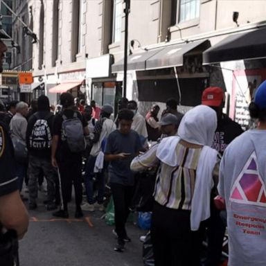 VIDEO: Migrant crisis in NYC deepens with hundreds lined up outside packed hotel 