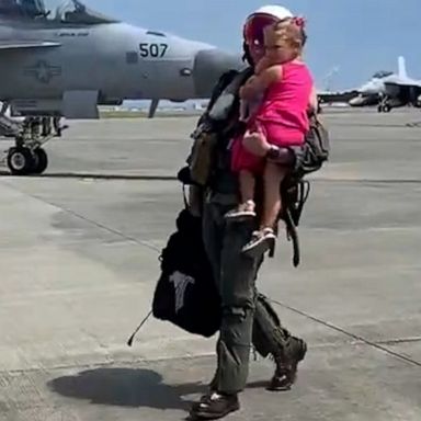 VIDEO: Girl runs to hug navy dad when he returns from deployment 