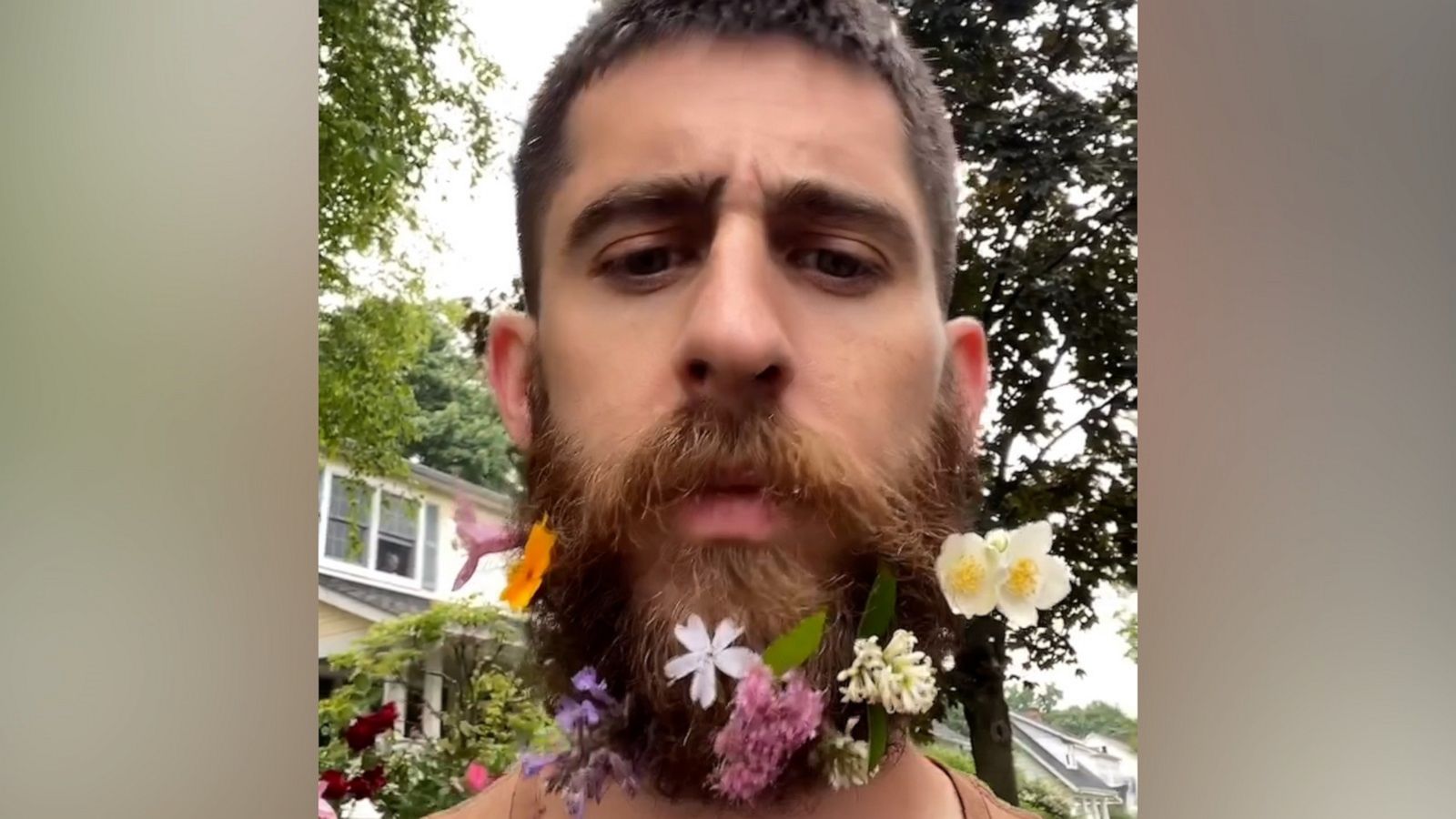 VIDEO: Dad puts flowers in beard for safekeeping during walk with daughter