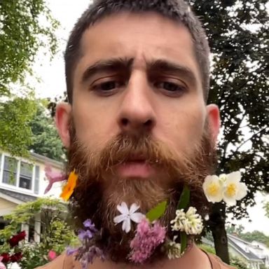 VIDEO: Dad puts flowers in beard for safekeeping during walk with daughter 