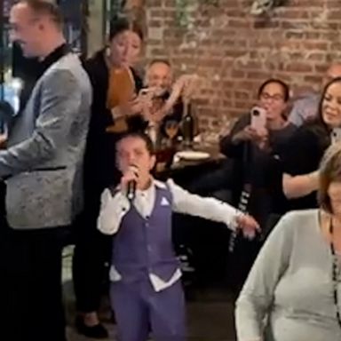 VIDEO: 7-year-old shows outstanding stage presence at parent's anniversary dinner 