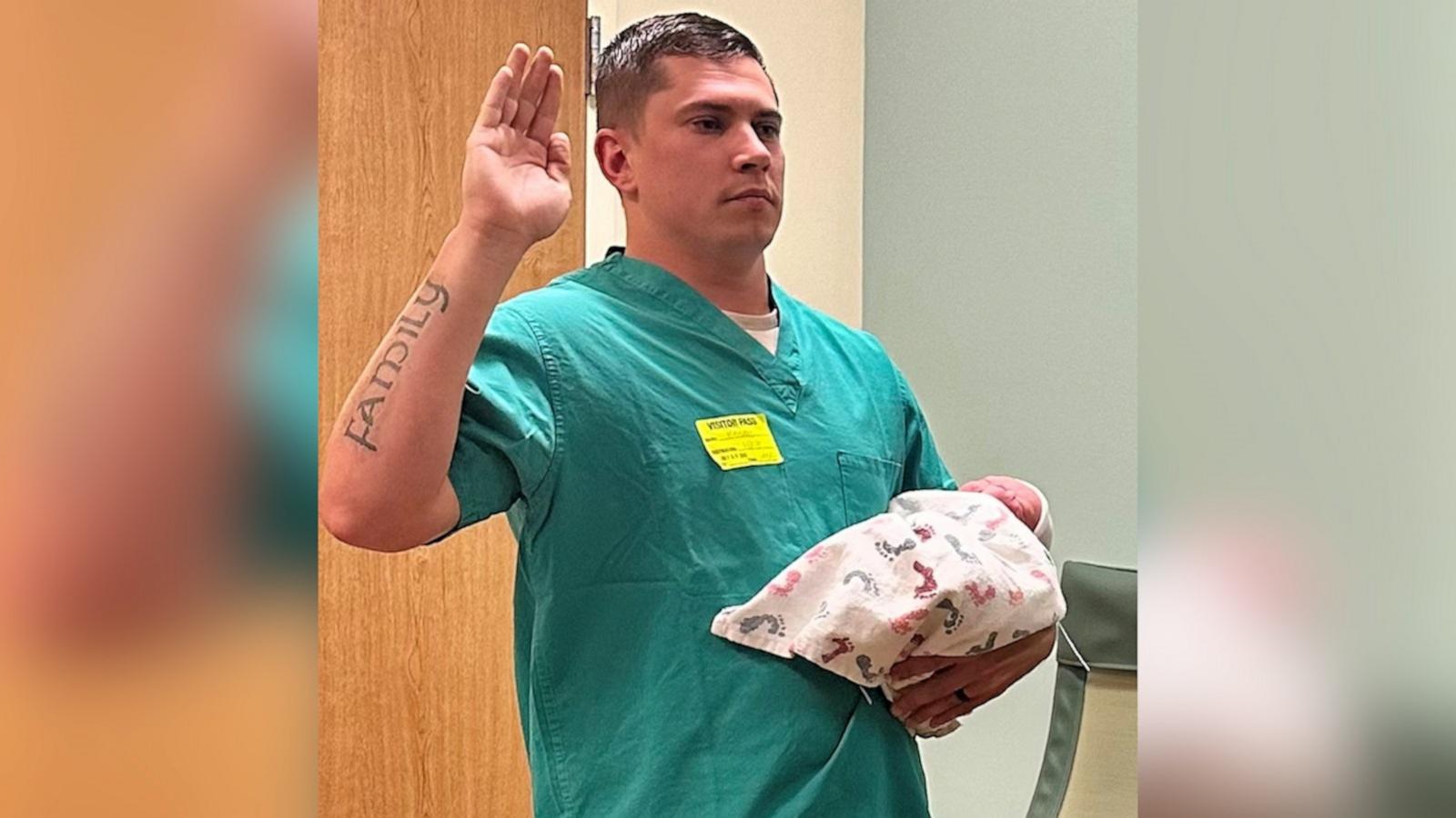 VIDEO: Police officer sworn in at hospital while holding newborn son