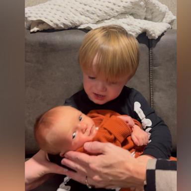 VIDEO: Toddler knows the perfect lullaby to sing to his baby brother: 'We Will Rock You'