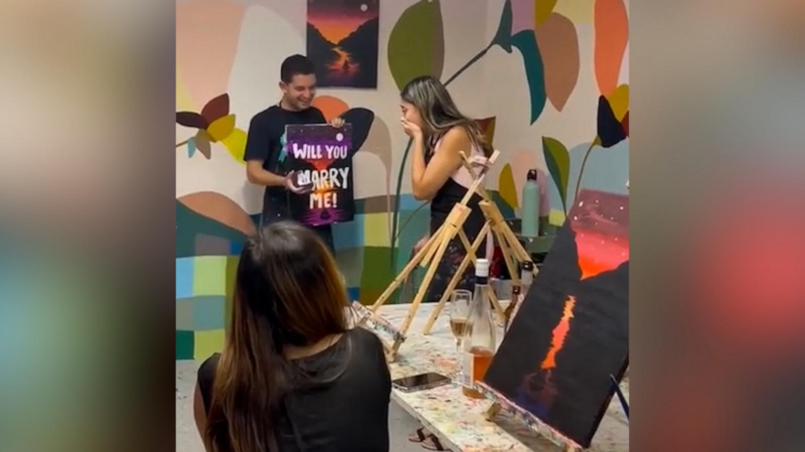 VIDEO: Surprise proposal at painting class catches woman totally off guard