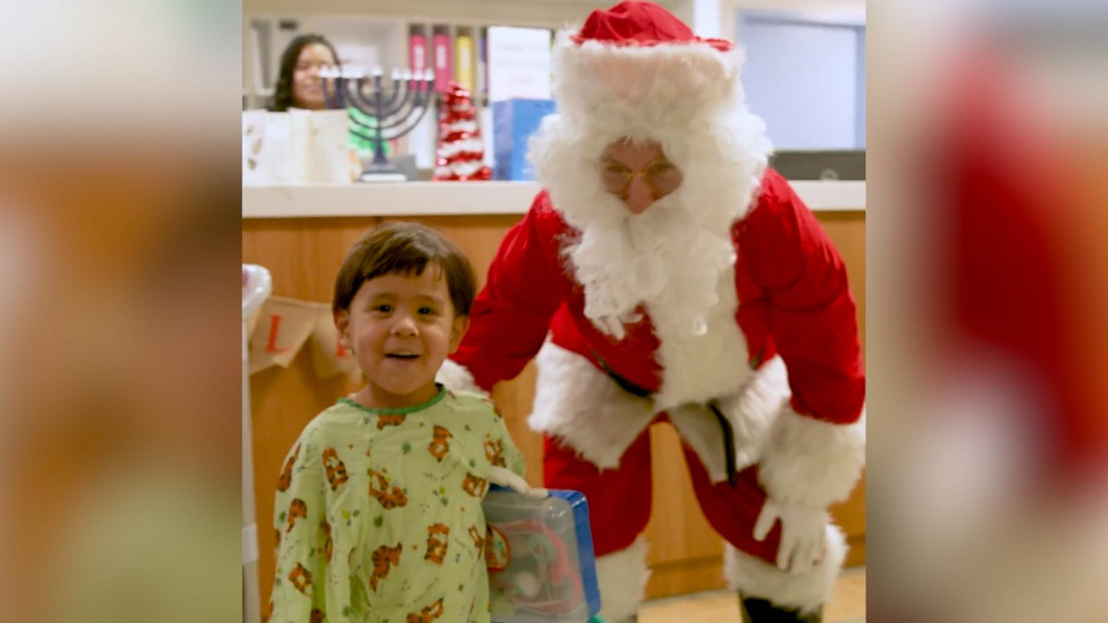 VIDEO: Watch the heartwarming moment a little boy runs up and hugs Santa Claus