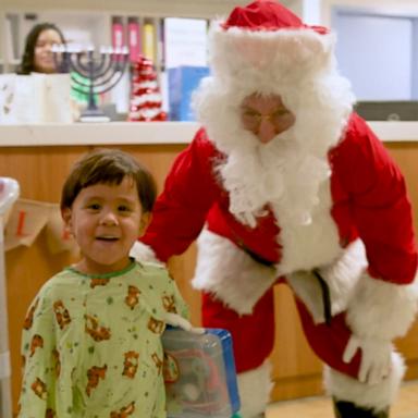 VIDEO: Watch the heartwarming moment a little boy runs up and hugs Santa Claus