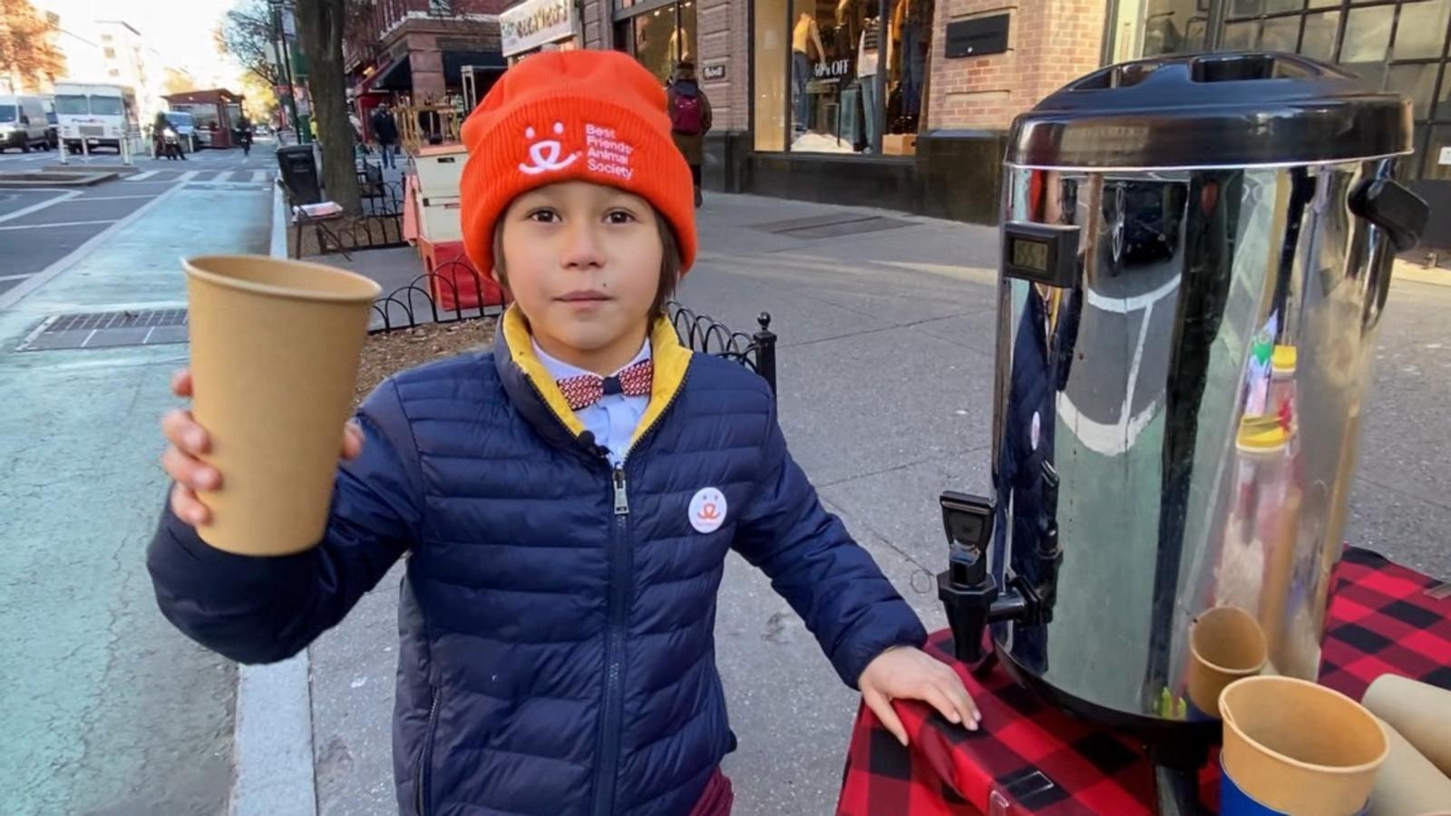 PHOTO: Julian Lin serves hot chocolate in New York City to raise money for local animal charities.