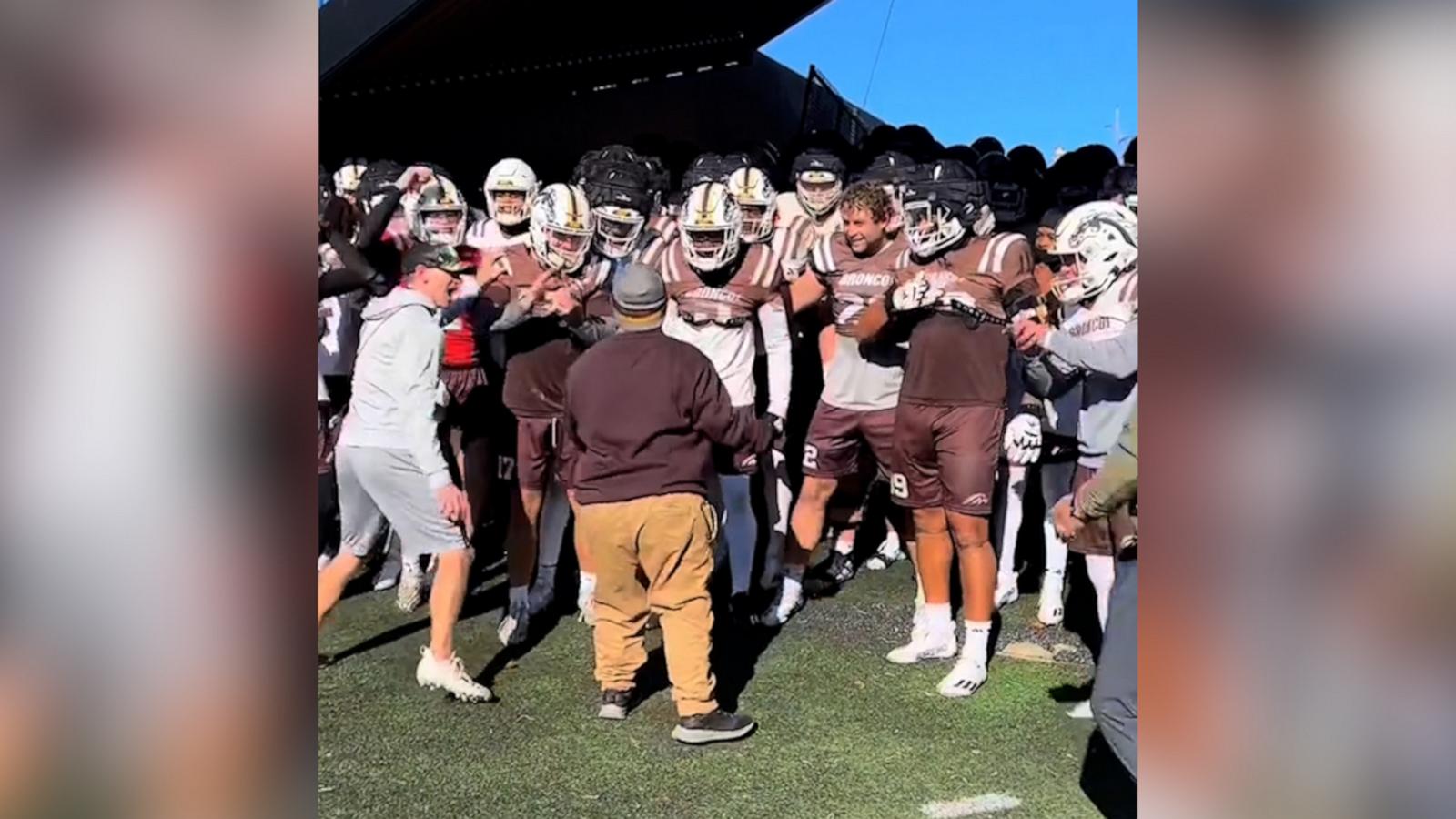 VIDEO: Teen boy with Down syndrome gets surprise visit with favorite college football team