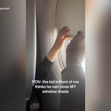 VIDEO: Plane passenger and toddler battle over window shade in viral video