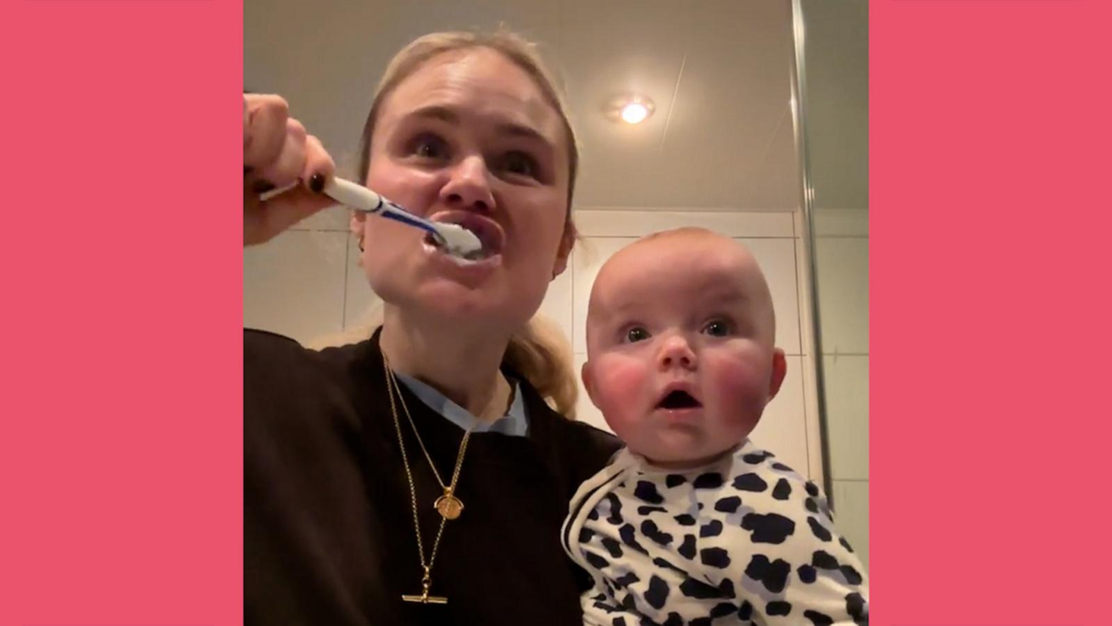 Baby is hypnotized watching mom brush her teeth - Good Morning America