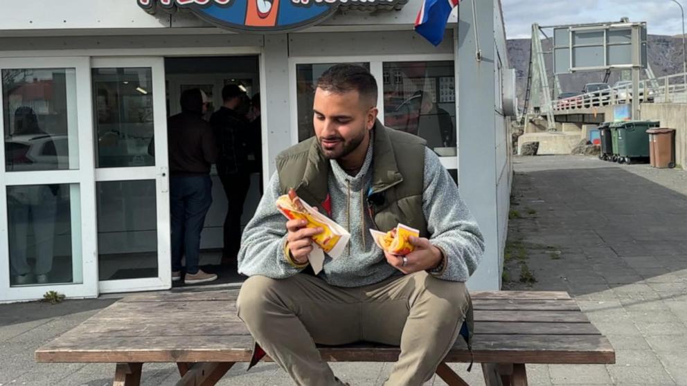 PHOTO: ABC News' Ashan Singh enjoys a roadside hot dog in Iceland.