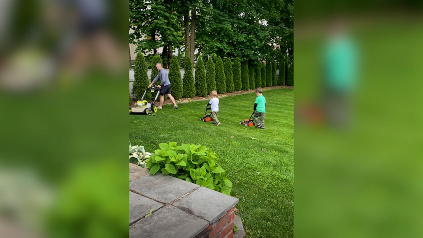 VIDEO: Check out this heartwarming moment of a dad and his sons mowing the lawn