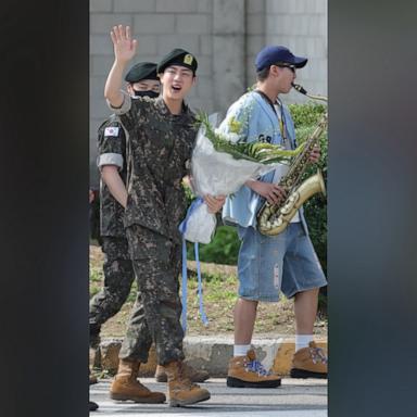 RM played the trumpet as fellow BTS members J-Hope, Jimin, V, and Jungkook lined up to embrace Jin, who was discharged from his mandatory service in the South Korean military.