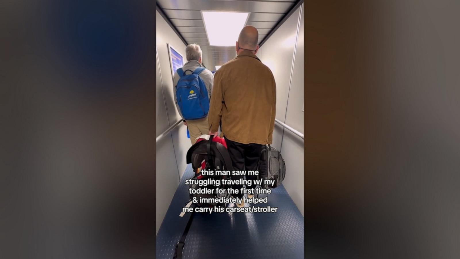 VIDEO: Man steps in to help mom traveling with toddler for 1st time