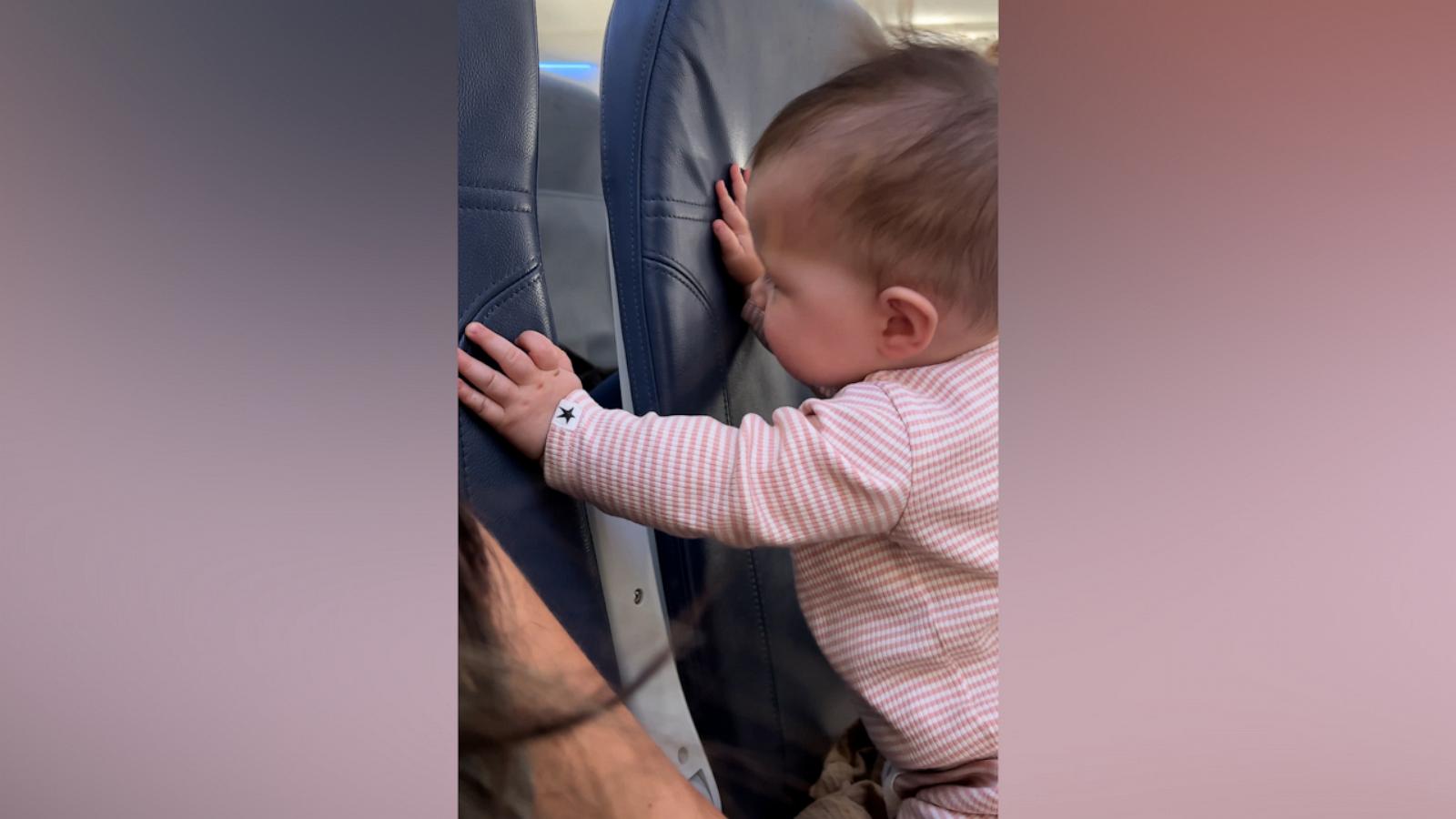 VIDEO: This baby on a flight became besties with the passengers behind her