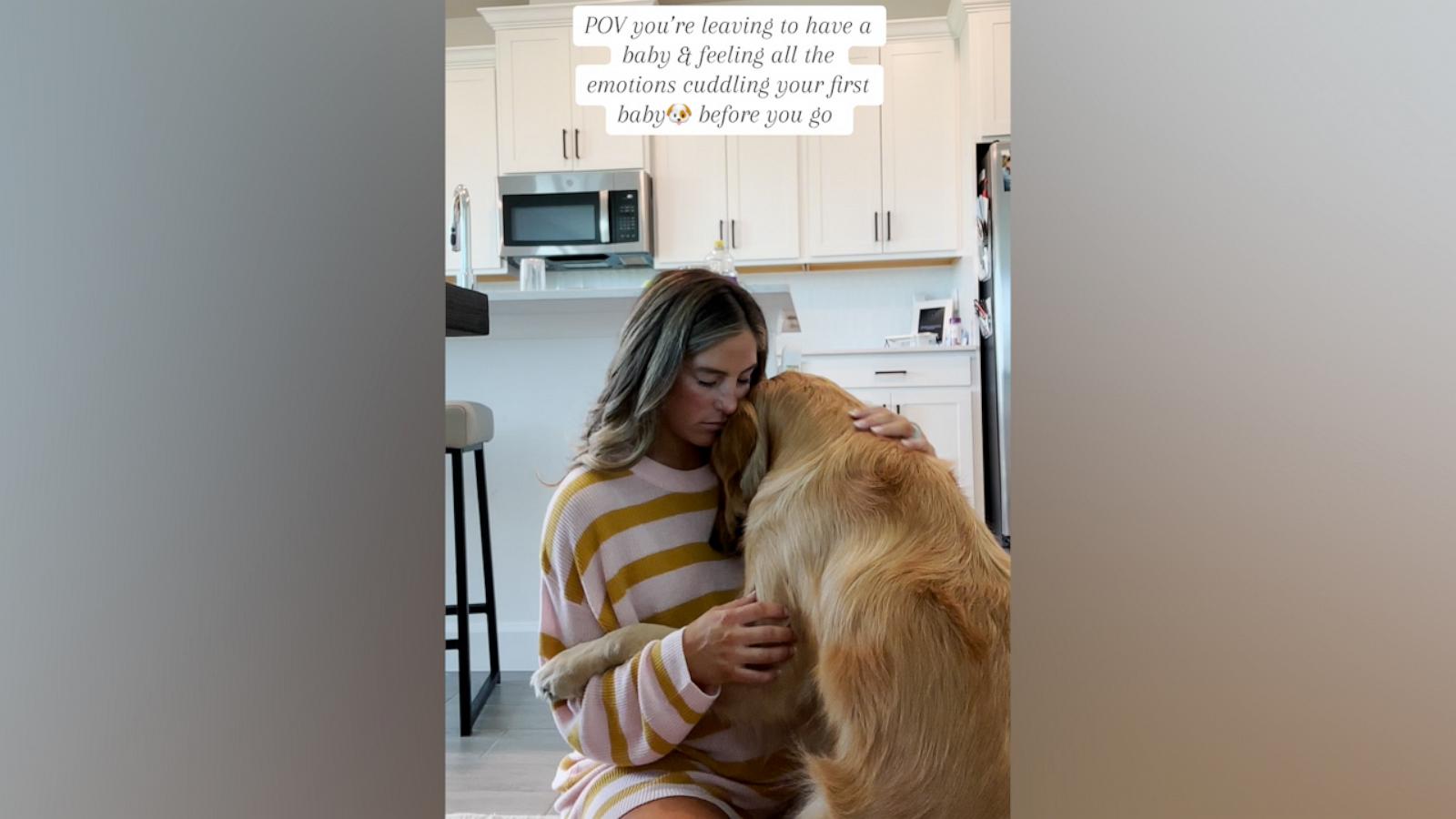 This woman and her pup share a sweet embrace at home before her son is born