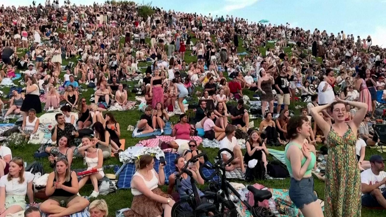 Thousands of Taylor Swift fans gather on hill in Munich to listen to her concert