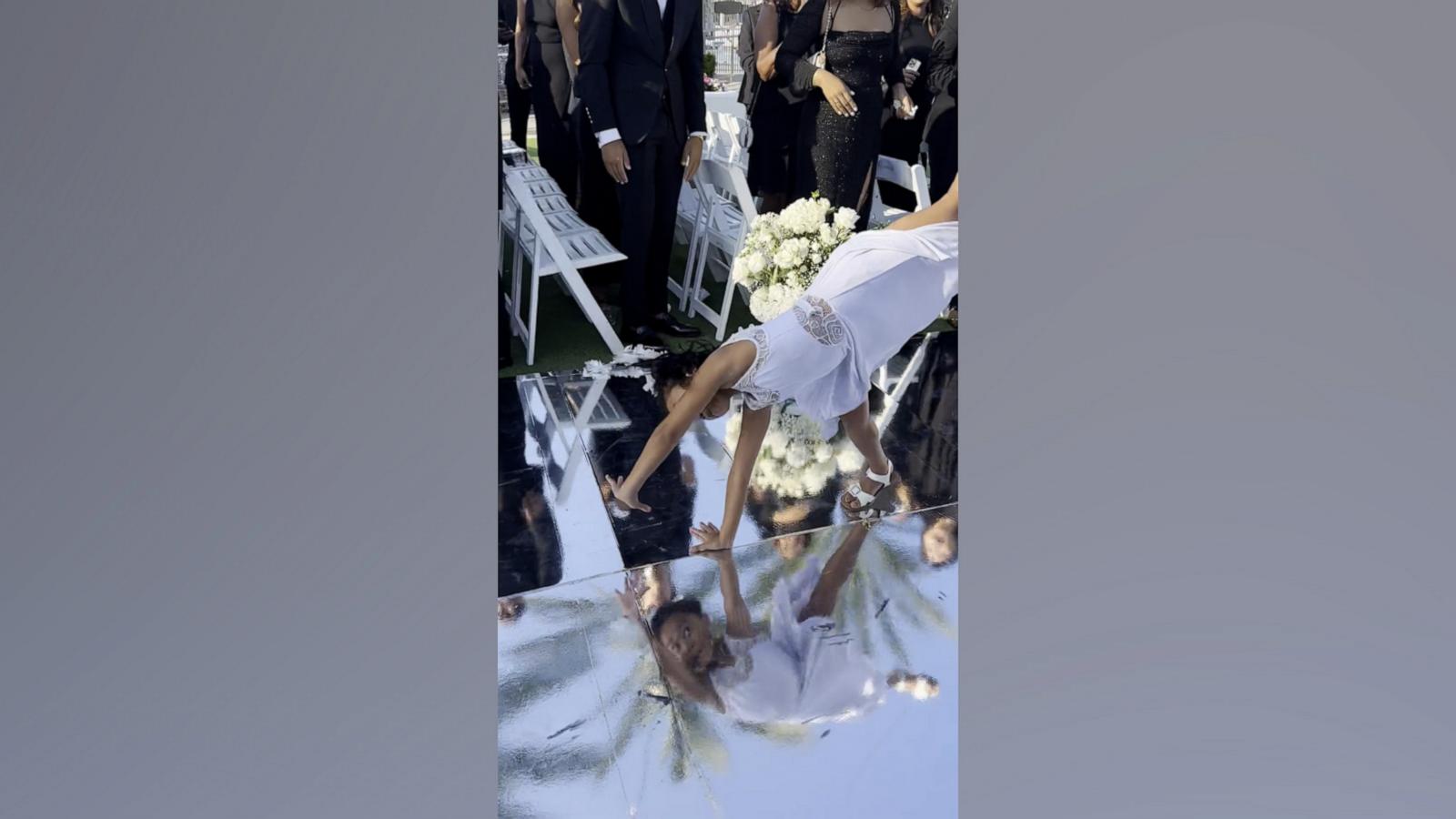 Raina Elegado posted a video of her daughter, who is a competitive dancer, doing a series of backflips down the aisle at the end of a wedding ceremony.