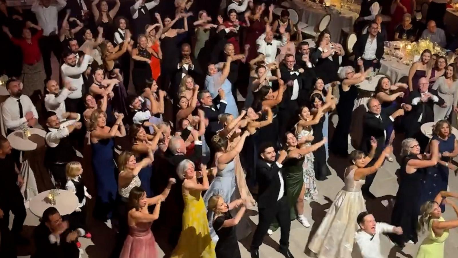 VIDEO: See the heartwarming moment wedding guests surprise bride with ABBA-themed flash mob