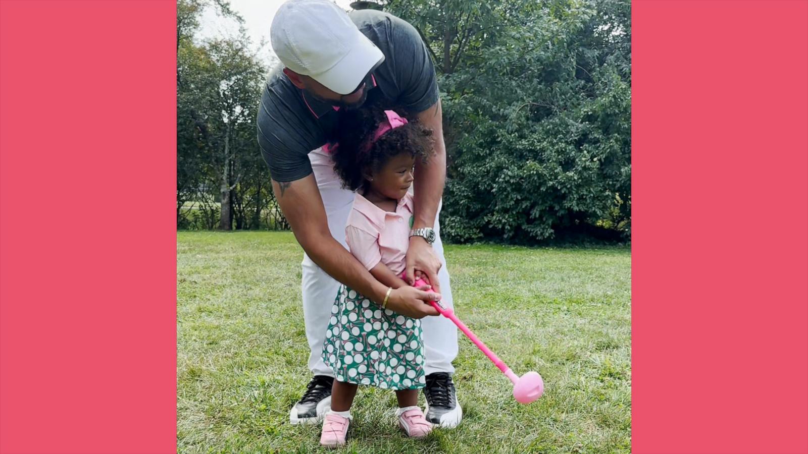 Dad shares an adorable moment teaching his 2-year-old daughter to play golf