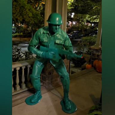 Greg Berzinsky transformed into the "little green army man" using a tent tarp with matching toy and army accessories.