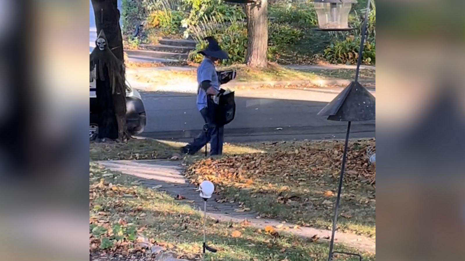 Mail carrier brings Halloween spirit with witch hat