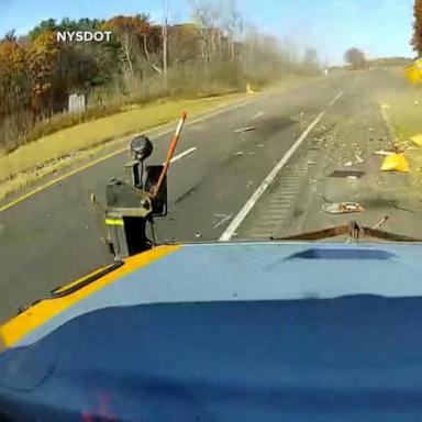 VIDEO: Worker narrowly avoids being hit by truck on New York highway