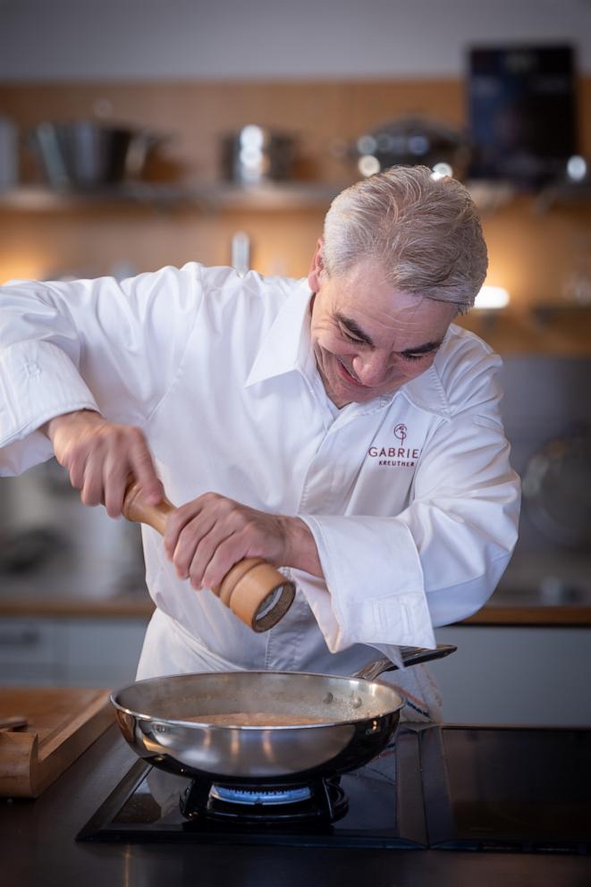 PHOTO: Chef Gabriel Kreuther cooks a smoked salmon sauce using the new Cristel cookware line. 