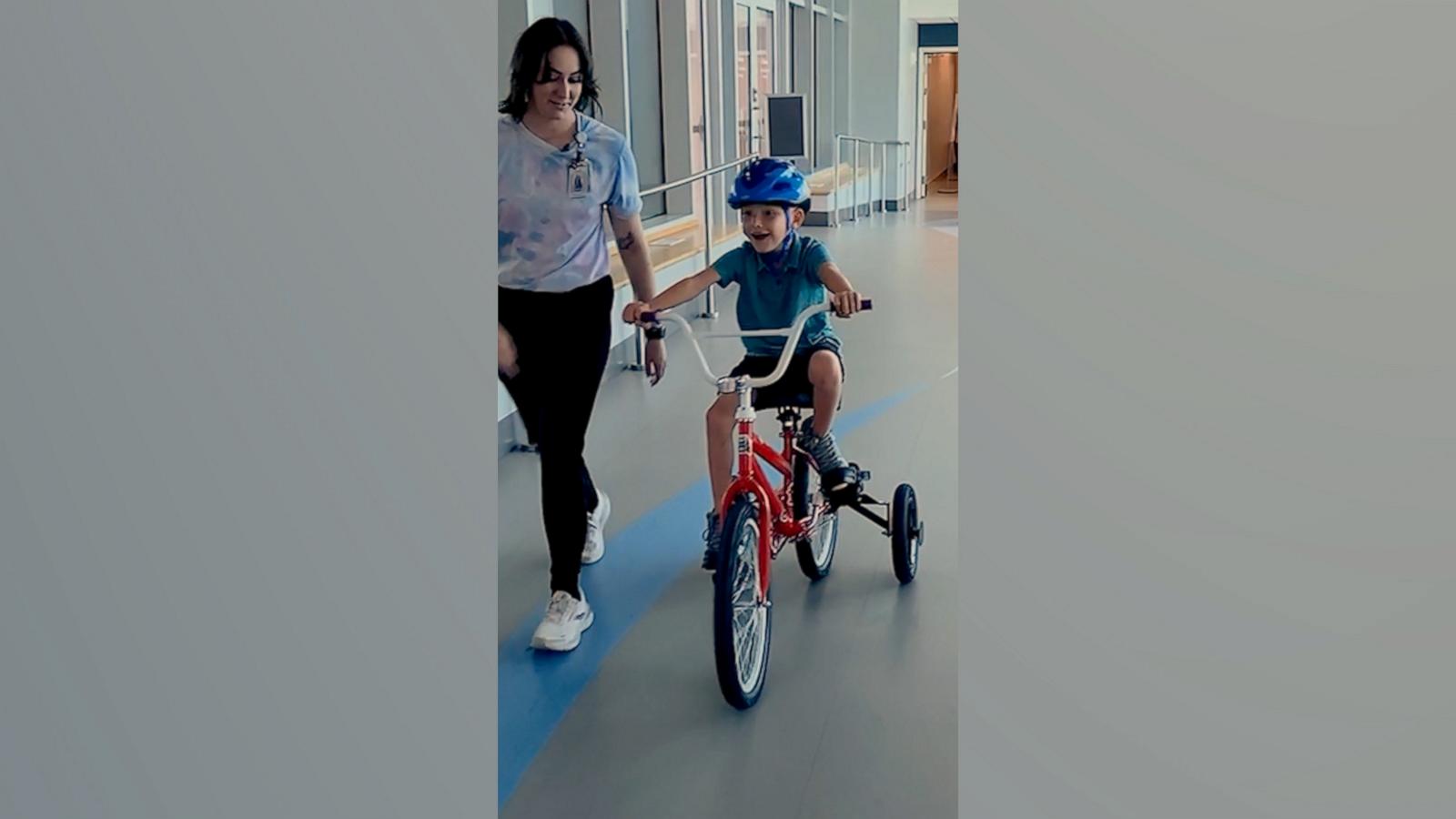 VIDEO: 7-year-old with rare genetic condition rides bike for 1st time