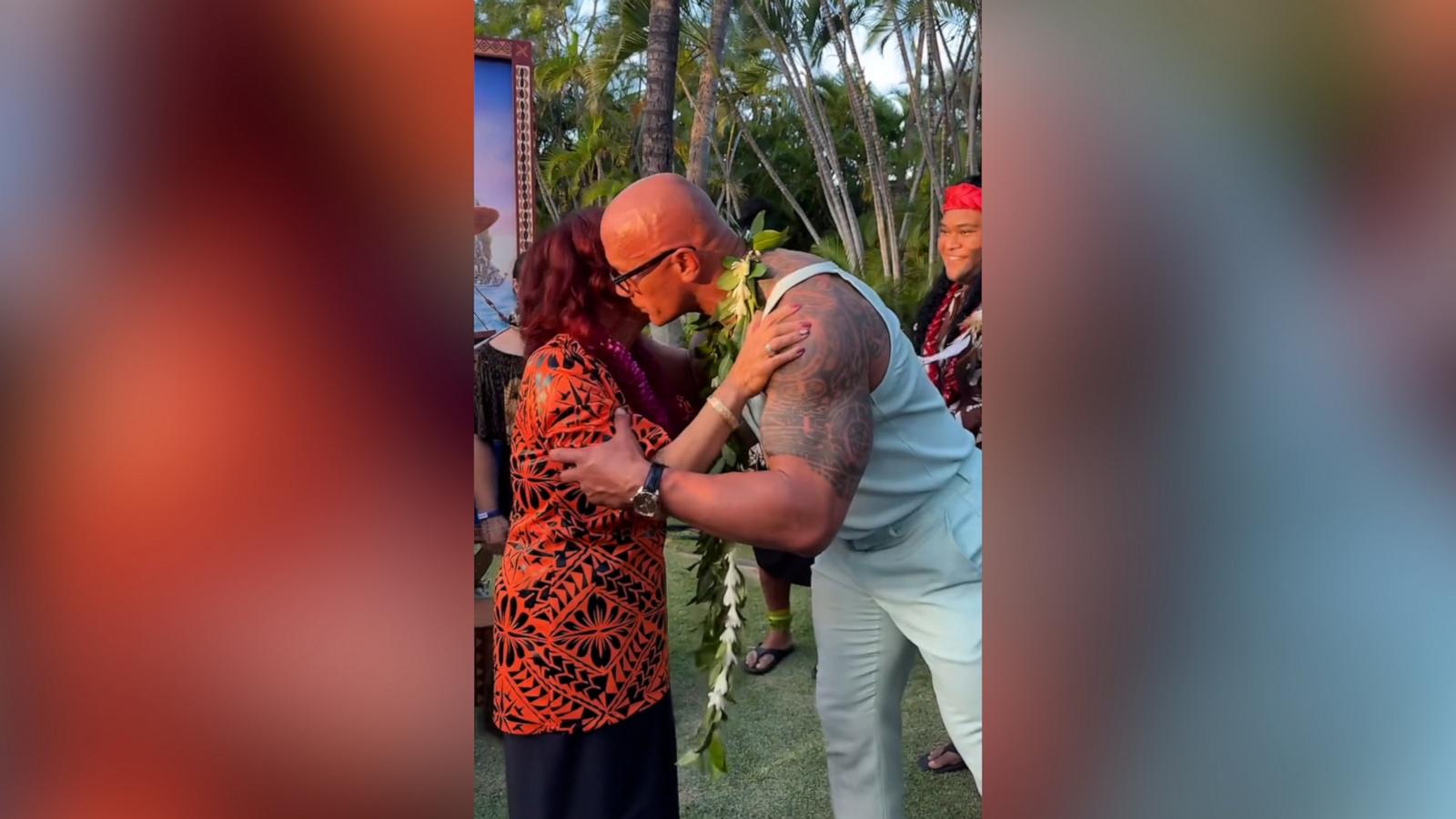 After his mom Ata motioned for him to join her, Dwayne Johnson took off his suit jacket, kissed his daughters on their heads and joined the traditional Polynesian dance without missing a beat.