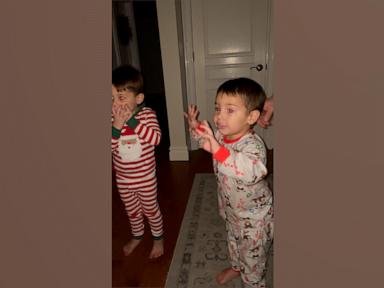 WATCH:  Mom and kids sneak downstairs to see Santa leaving gifts under Christmas tree