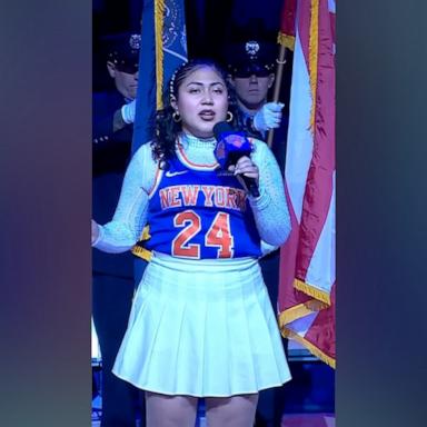 Brithny Liceli Gomez was singing the National Anthem at a Knicks game when she stopped after someone shouted. After awkward silence, the crowd cheered her on and she delivered a stunning performance.