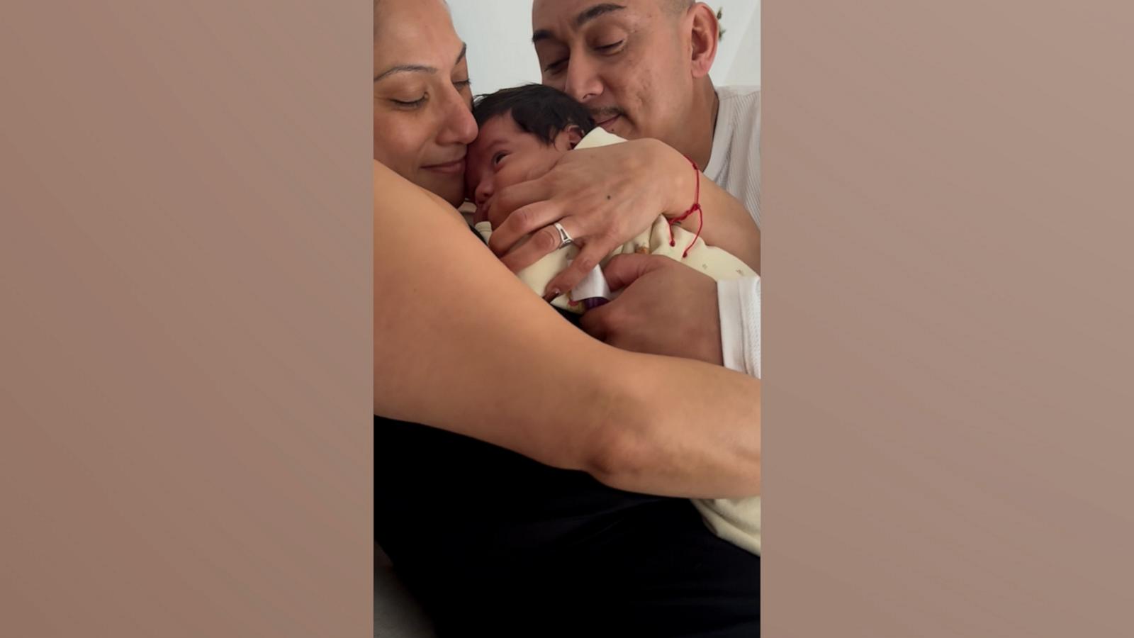 Grandparents fight over who gets to hold newborn grandbaby