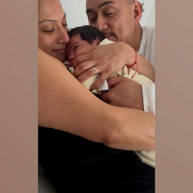 Grandparents fight over who gets to hold newborn grandbaby