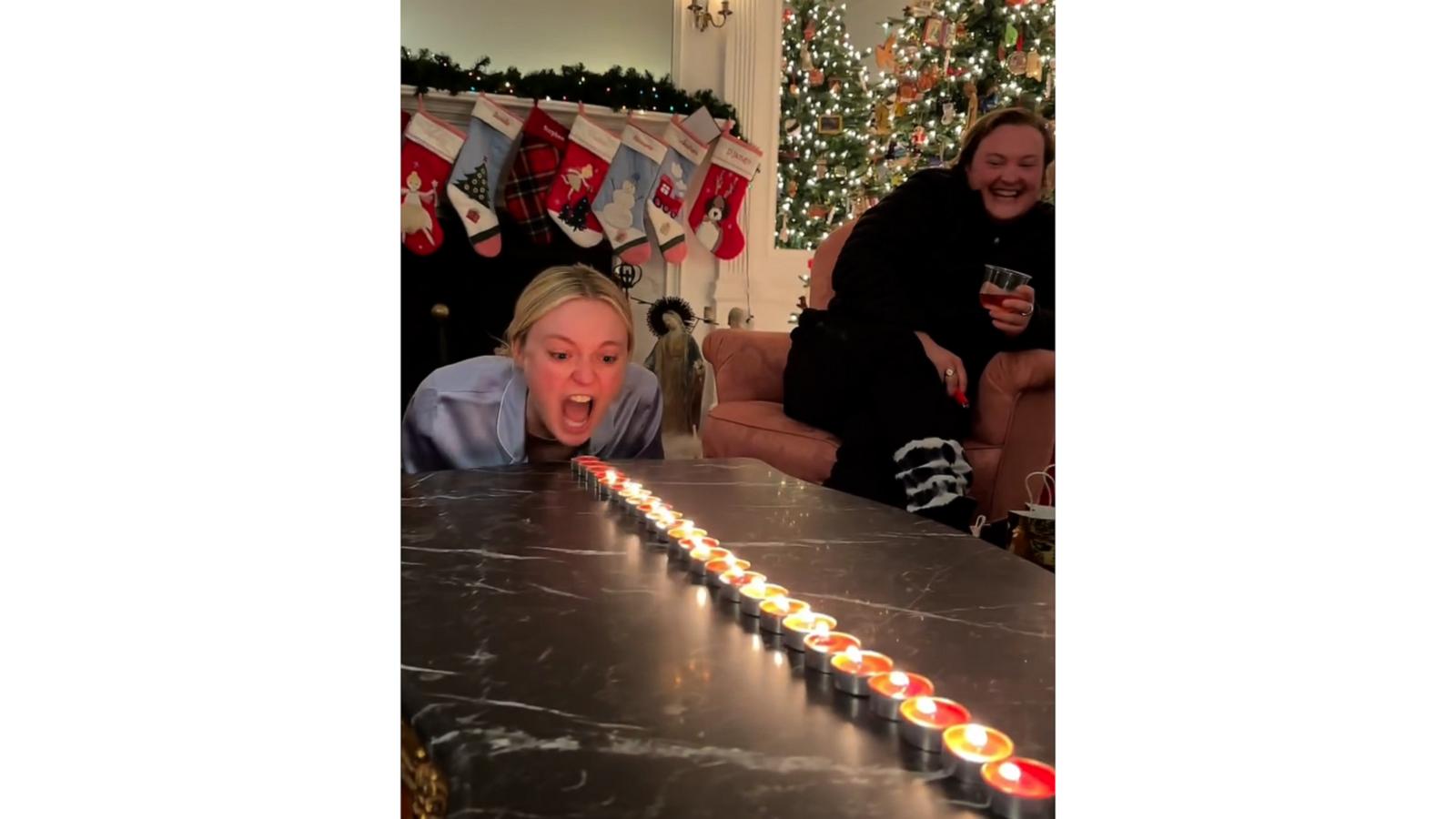 Dakota and Elle Fanning get in on Christmas candle challenge